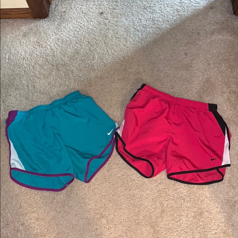 two pairs of nike athletic shorts